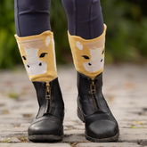 Child's wearing jodhpur boots and lemon horse face socks